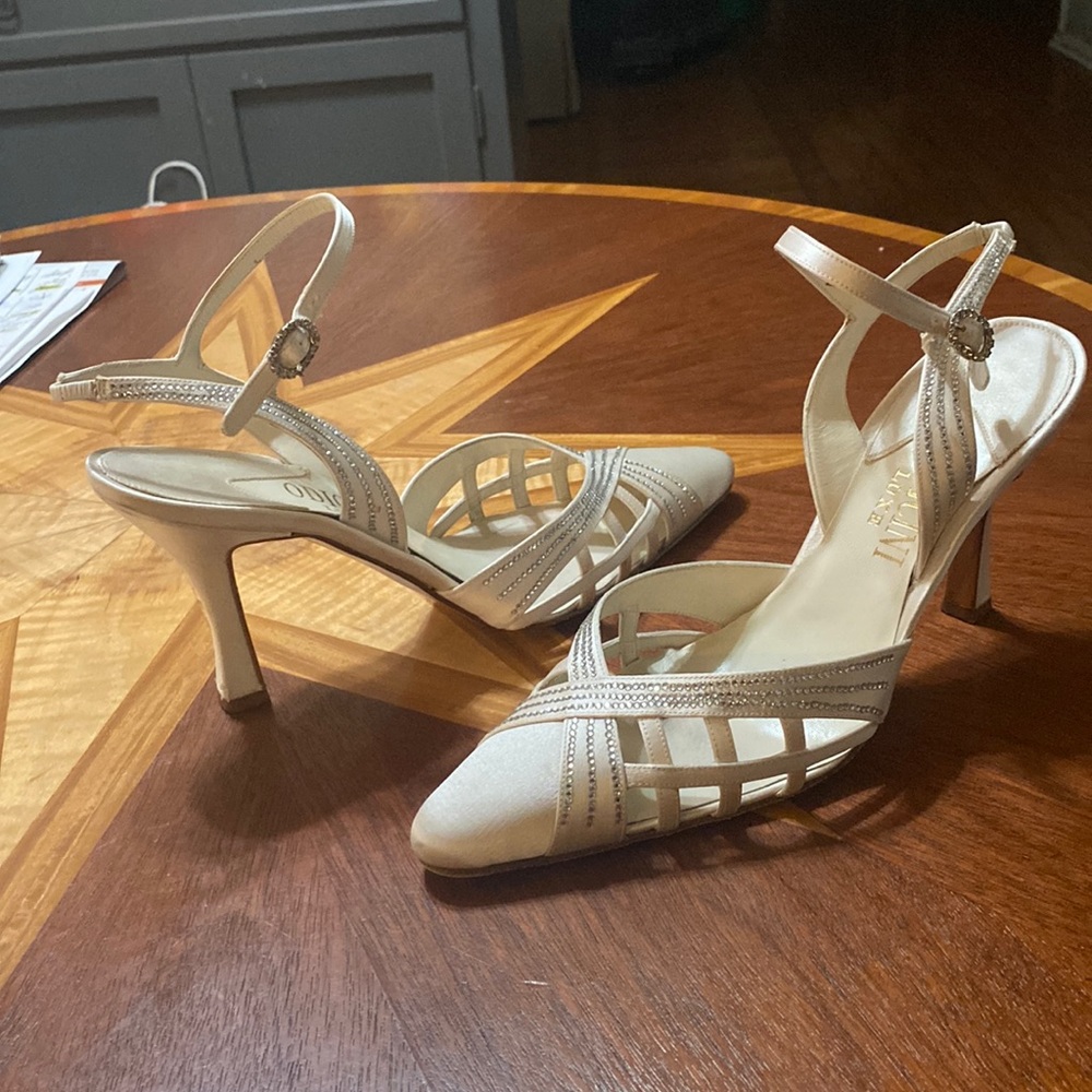 Satin with rhinestones, strap shoes,very clean, very tiny snag on one heel